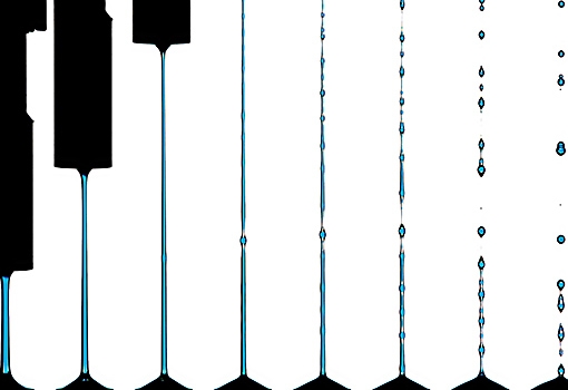 A still image from the video, showing (from left) one steel rod (top) pulling away from the oiher, causing the liquid to stretch and form filaments, which eventually break into droplets.