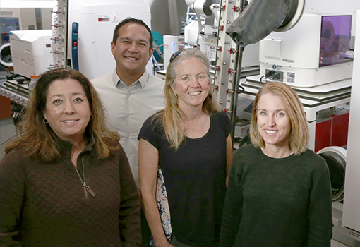 UC Santa Barbara collaborators (left to right) Michelle O’Malley, Ty Vernon, Jean Carlson, and Elaine Kirschke stand in the NSF ExFAB Biofoundry, a state-of-the-art facility central to the university’s newly awarded project.