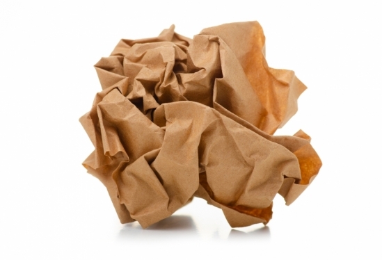 Image of a wadded-up paper, which, when released, unfolds slowly, as does the protein in question in this study.